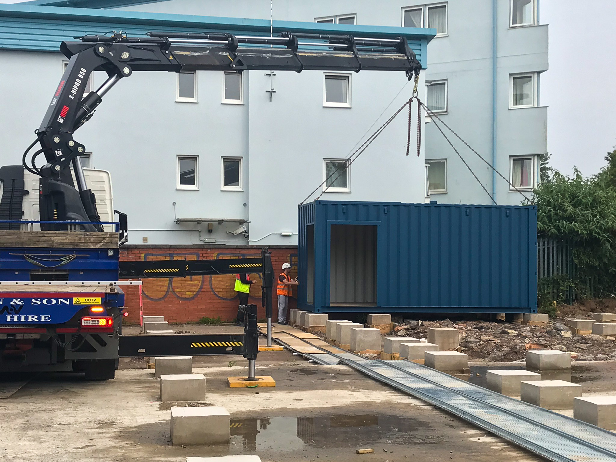 20ft container being lifted into place